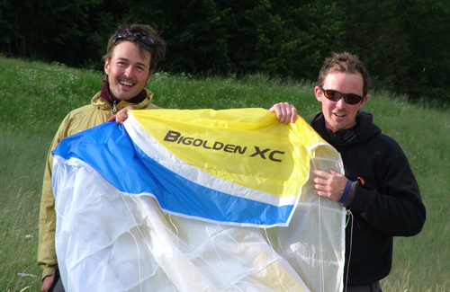 Toby Colombe (R) and Cefn Hoile hold their Bi-Golden paraglider