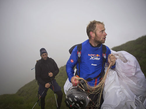 The heroic flatlander … Ferdinand van Schelven (NED) and his supporter hike to take off at Passo Tonale, Italy, 23 July 2011. Photo: Red Bull X-Alps