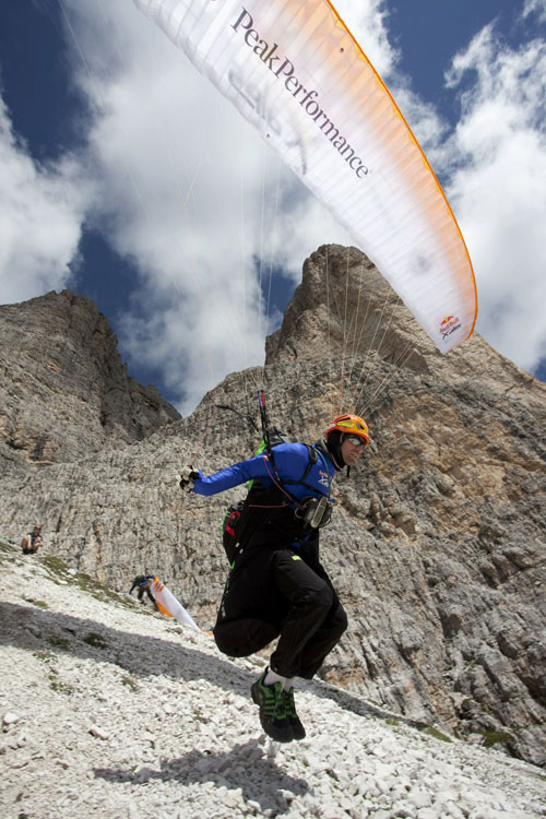 Michael Gerbert (GER) takes off at the foot of the Tre Cime during the Red Bull X-Alps, Italy on 21 July 2011. Photo: Red Bull X-Alps