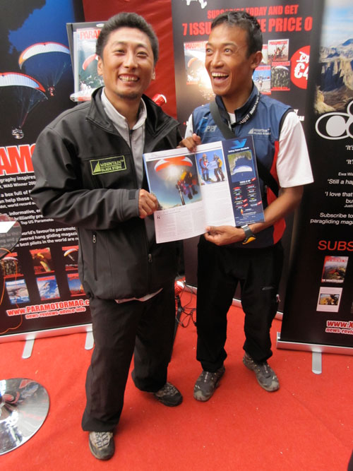 Babu (R) and Lakpa, Everest pilots, check out their photos in Cross Country mag