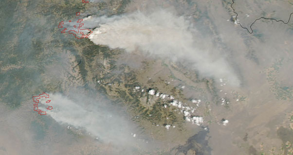 Smoke streams east from wildfires in Idaho, photographed by NASA on 14 August
