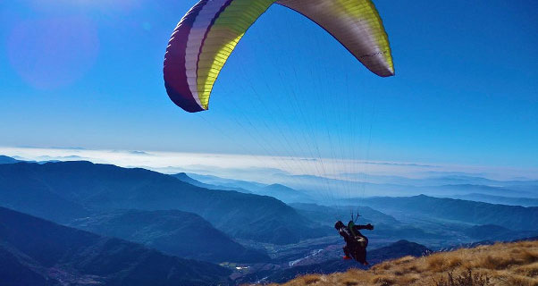 Mitch Riley paraglides in Nepal