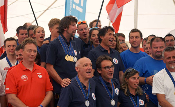 Team France sings La Marseillaise during the medal ceremony. Photo: Pascal Vallee
