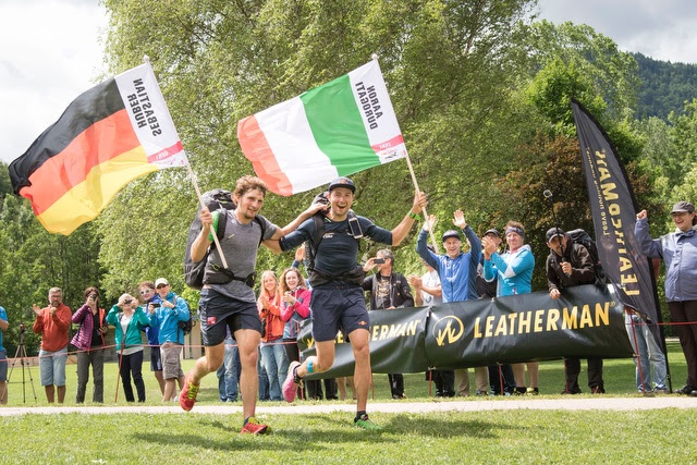 Seb Huber and Aaron Durogati cruise across the finish line at the Prologue during the Red Bull X-Alps 2017. Photo: Honza Zak