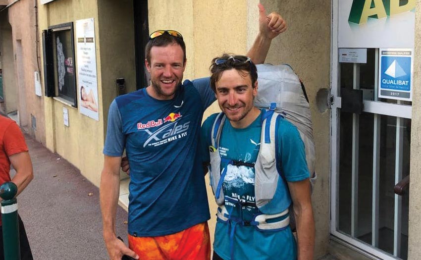 Chrigel greets Maxime Pinot as he finishes Red Bull X-Alps 2019