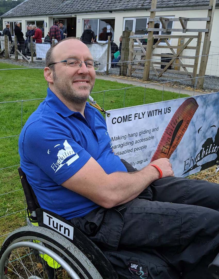 Handsome Ransome .. Flyability's George Ransome sports one of the charity's blue polo shirts. Photo: Flyability