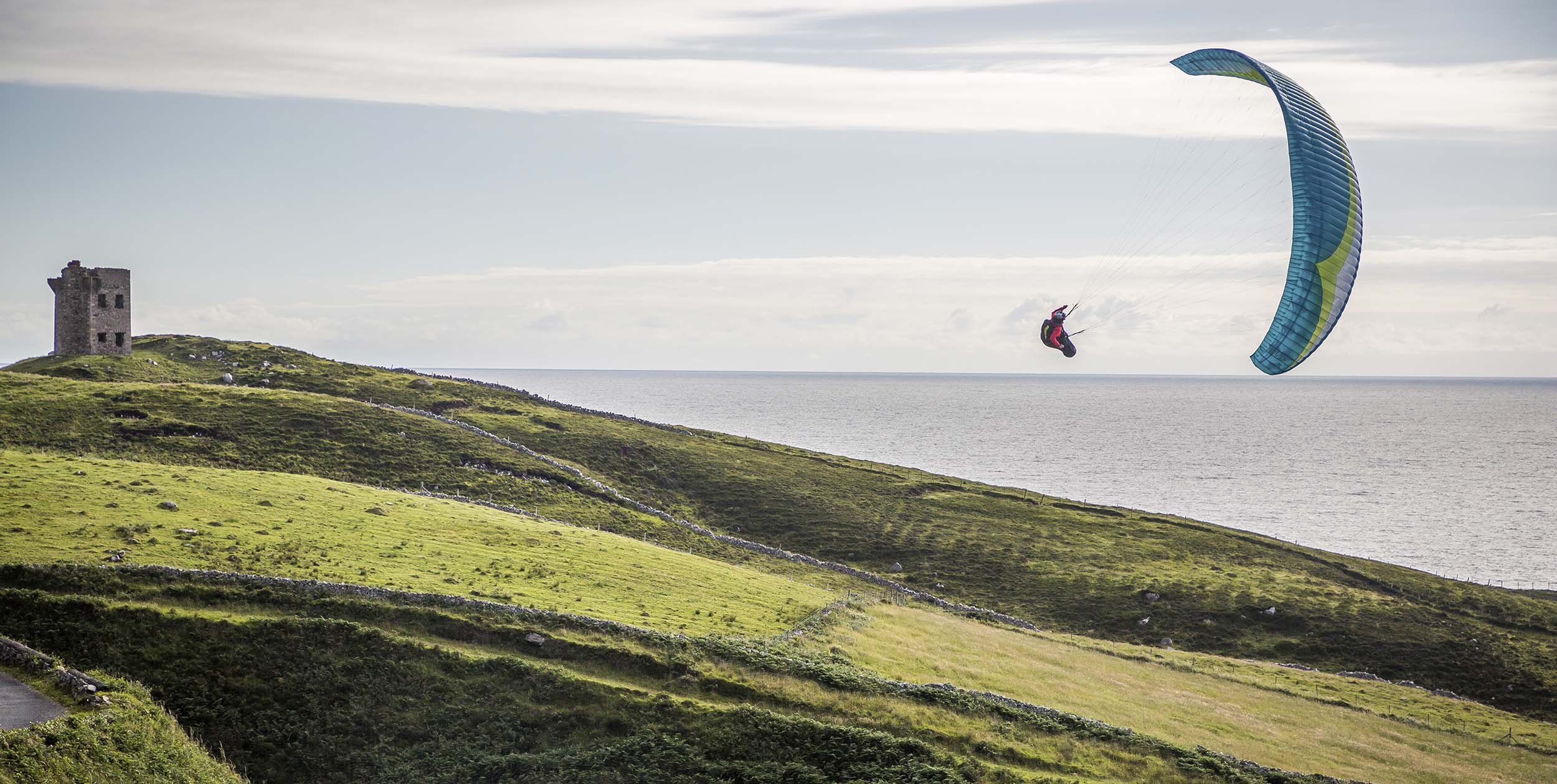 Will Gadd soaring a paragliding in Ireland. Photo: John Price / Red Bull Content Pool