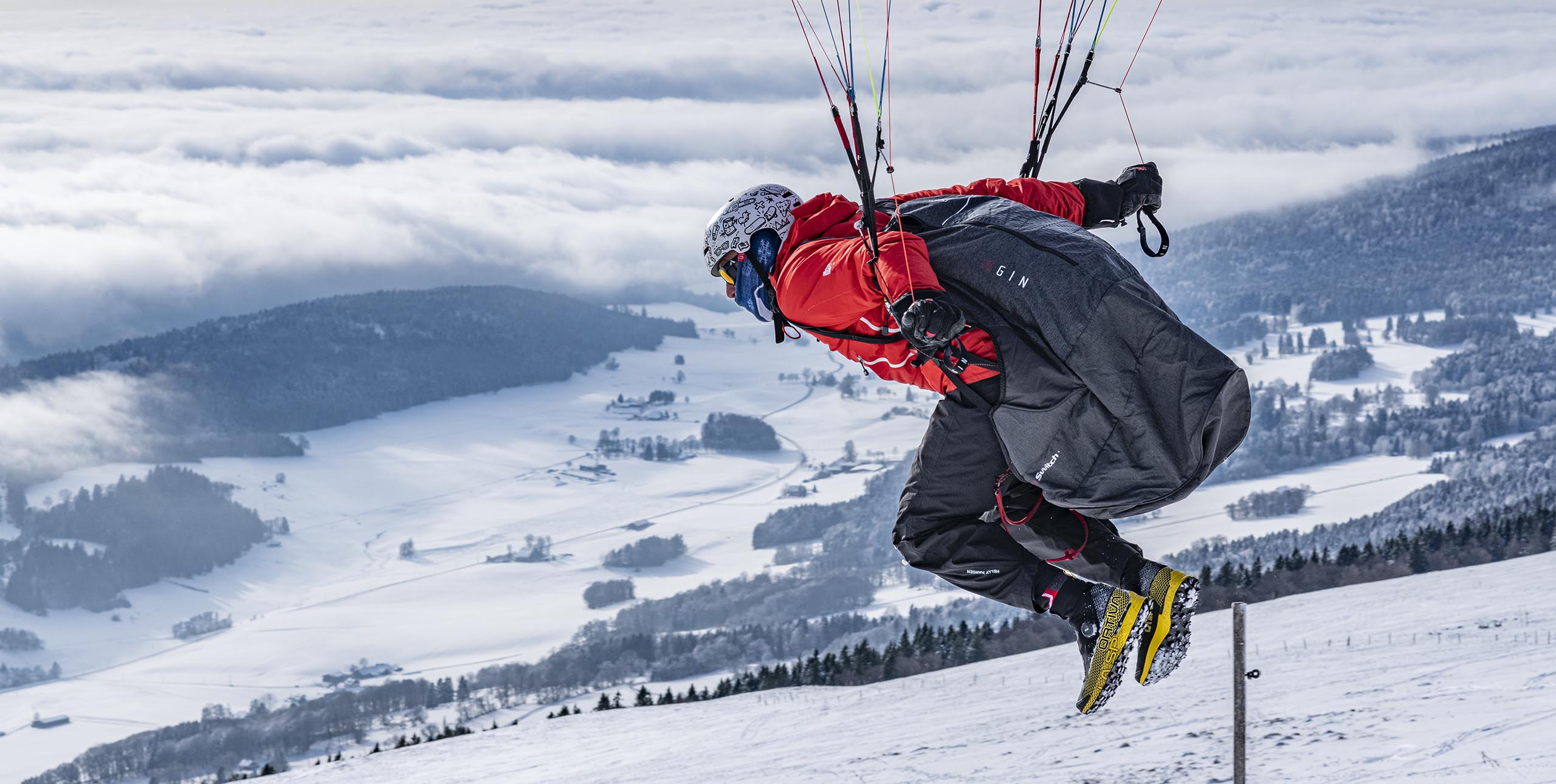 Tim Bollinger leans in to winter paragliding. Photo: Jerome Maupoint