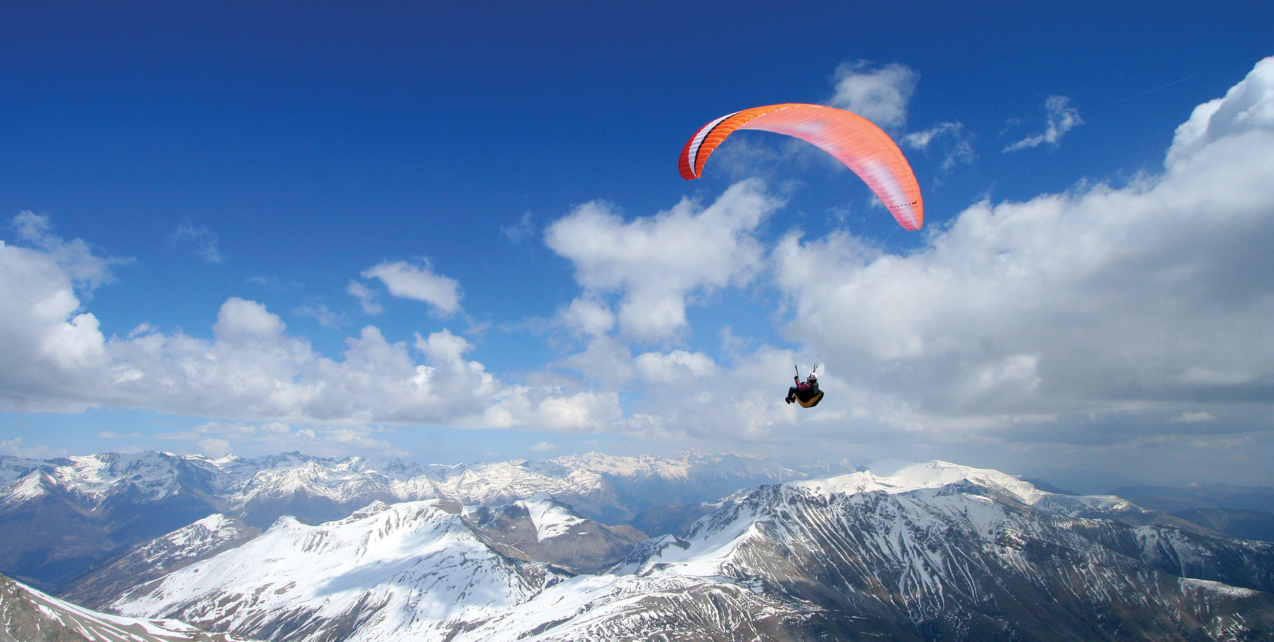 Spring paragliding in mountains