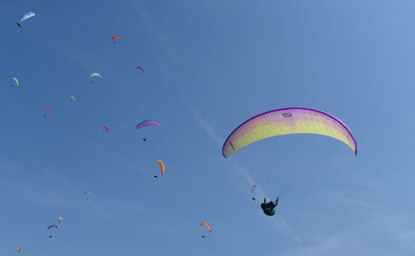 Paragliders flying above Colombia during the Ozone edition, SRS competition