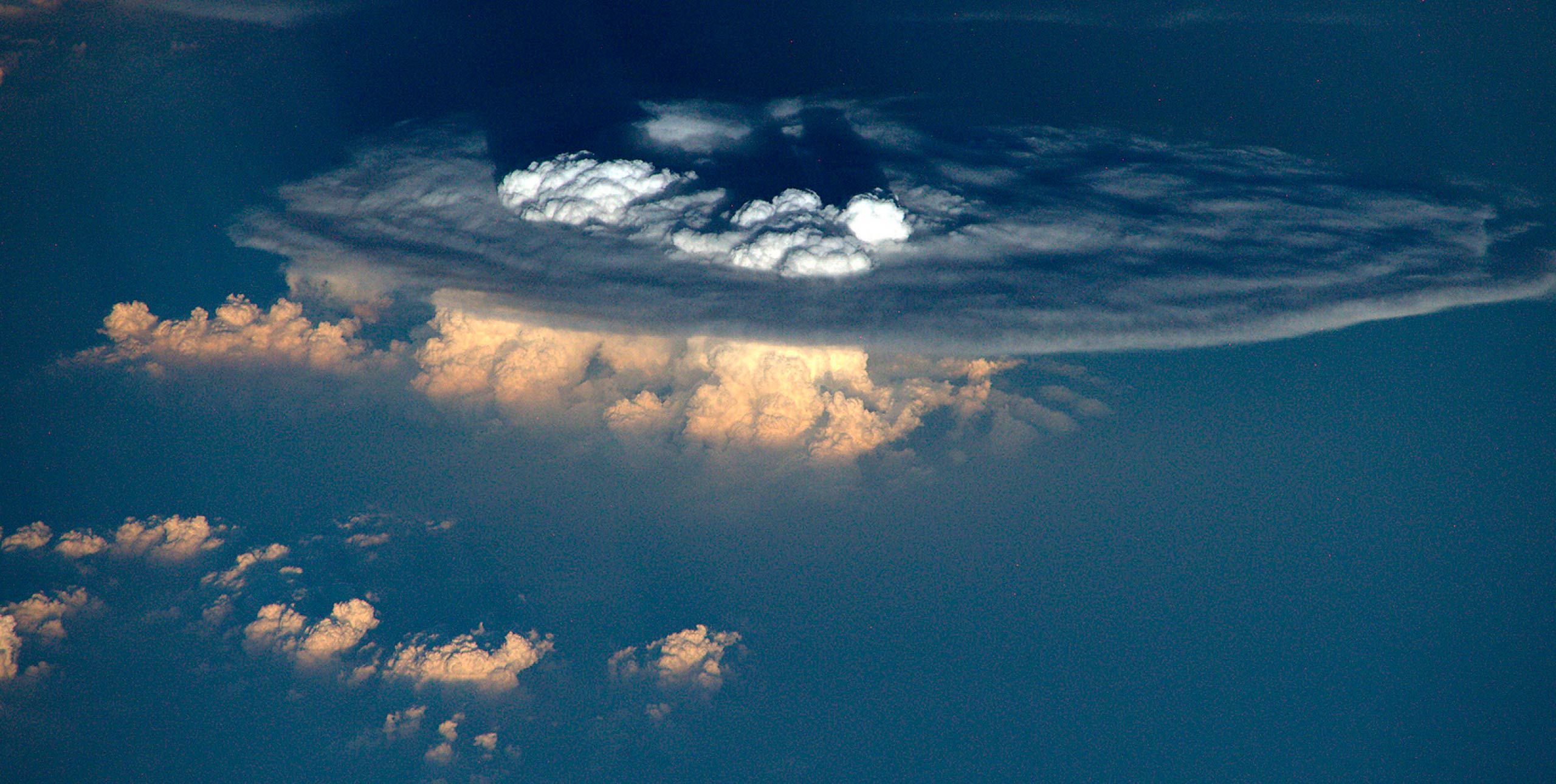 A cu-nim spreading horizontally when it hits the tropopause, as seen from orbit