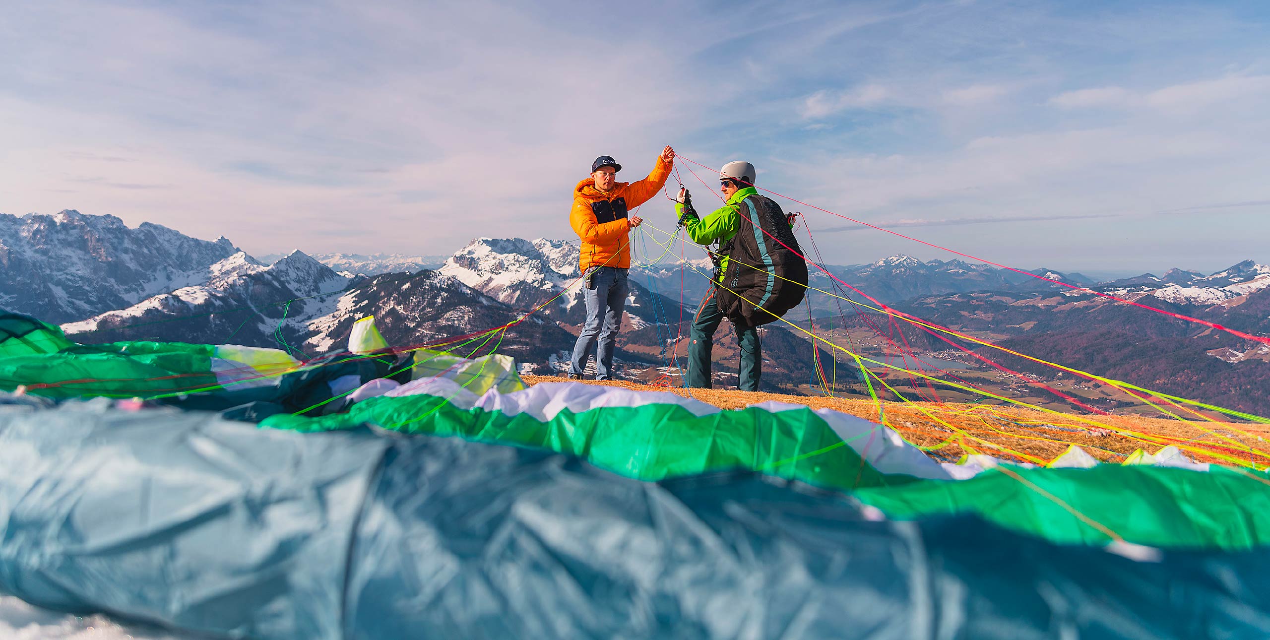 An instructor and student preparing to launch a paraglider. Photo: Fabian Gasteiger