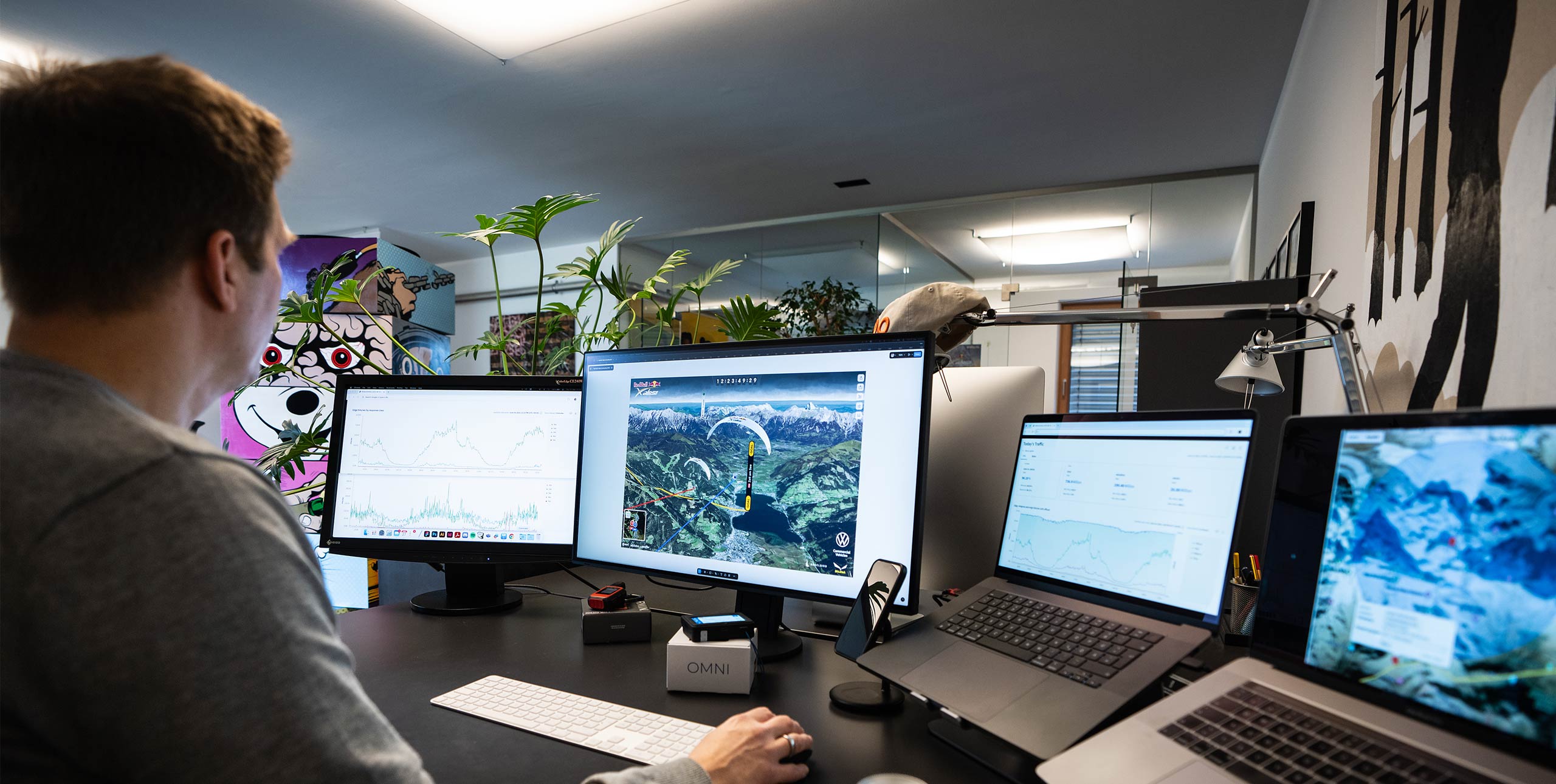 Hannes Maier, chief technical officer at the Red Bull X-Alps in front of his live-tracking screens at race HQ in Fuschl am See, Austria. Photo: Christian Lorenz/zooom