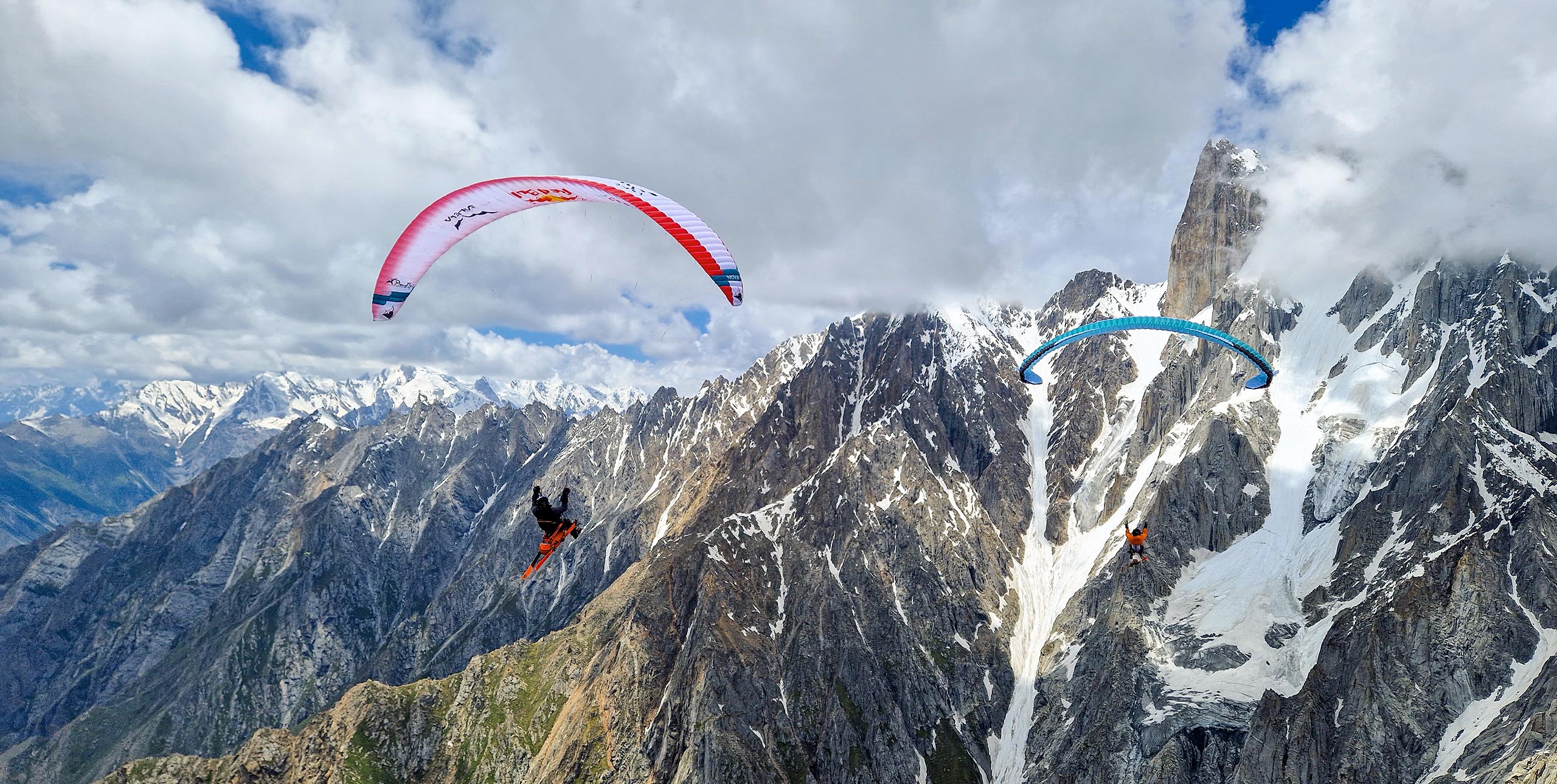 Aaron Durogati (left) and Matthias Weger while filming in Pakistan. The pilots have skis attached to their harnesses for combing skiing and flying vol bivouac in the mountains Photo: Jon Griffith / RBCP