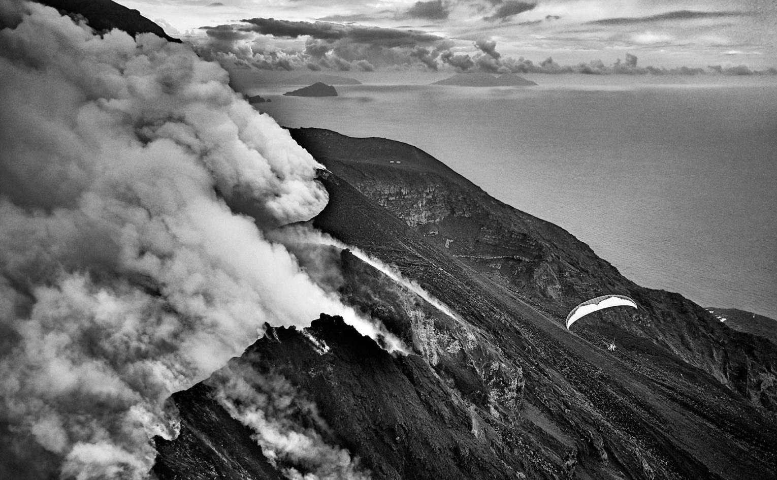Felix Wölk's captures Jochen Schweizer paragliding on Stromboli